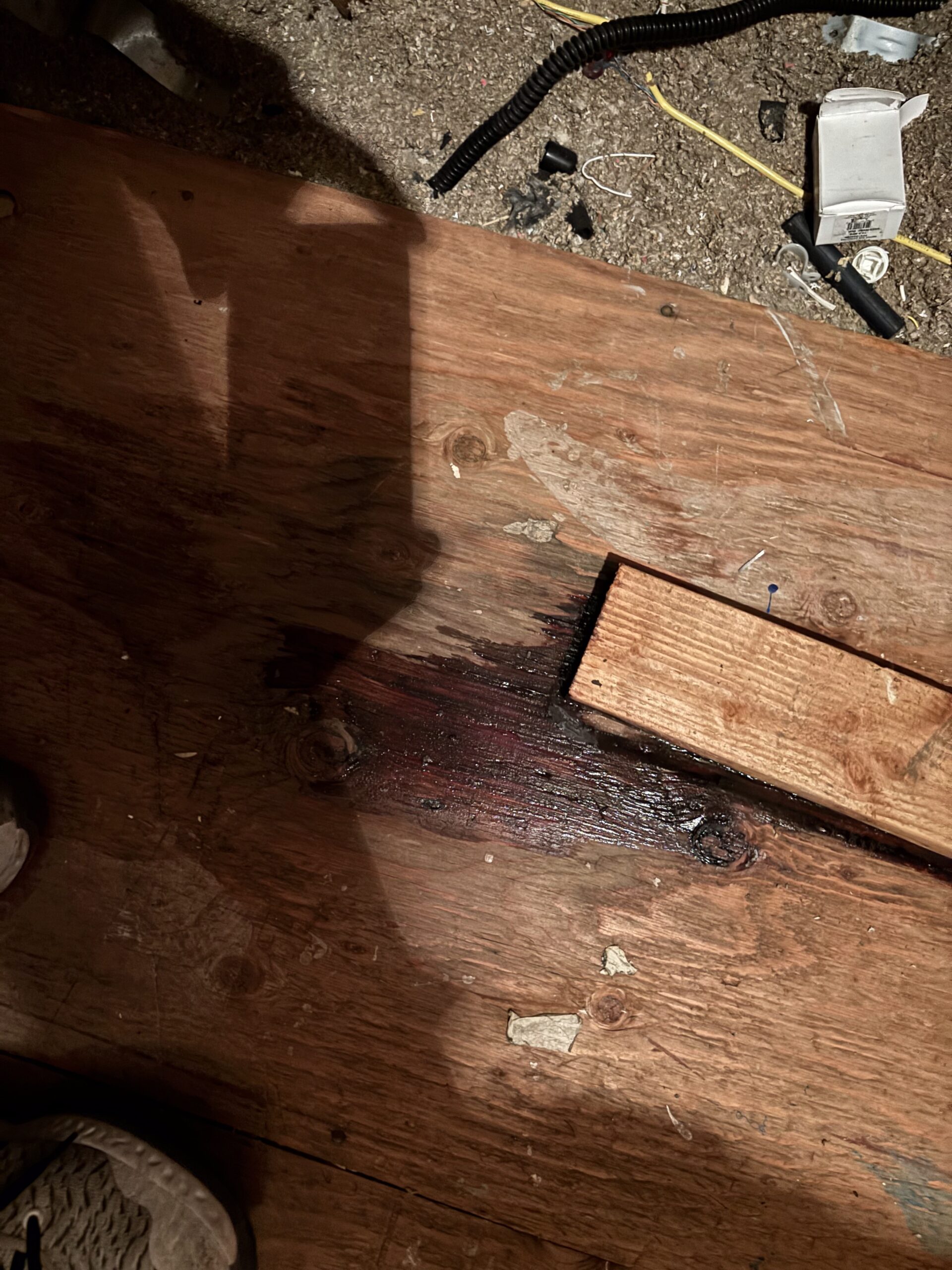 Water staining on attic wood platform caused by leaking furnace flue pipe in Lincoln CA