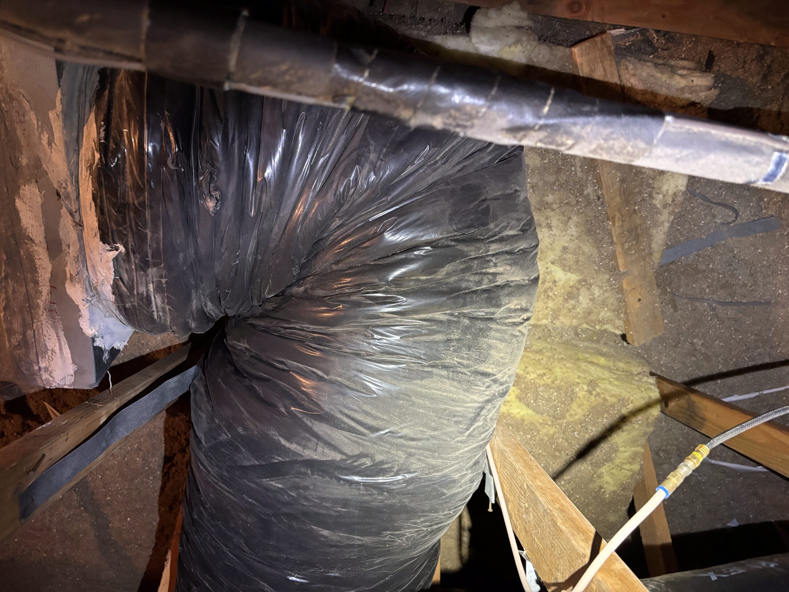 Incorrectly installed furnace flue pipe inside attic before repair in Sun City Hills