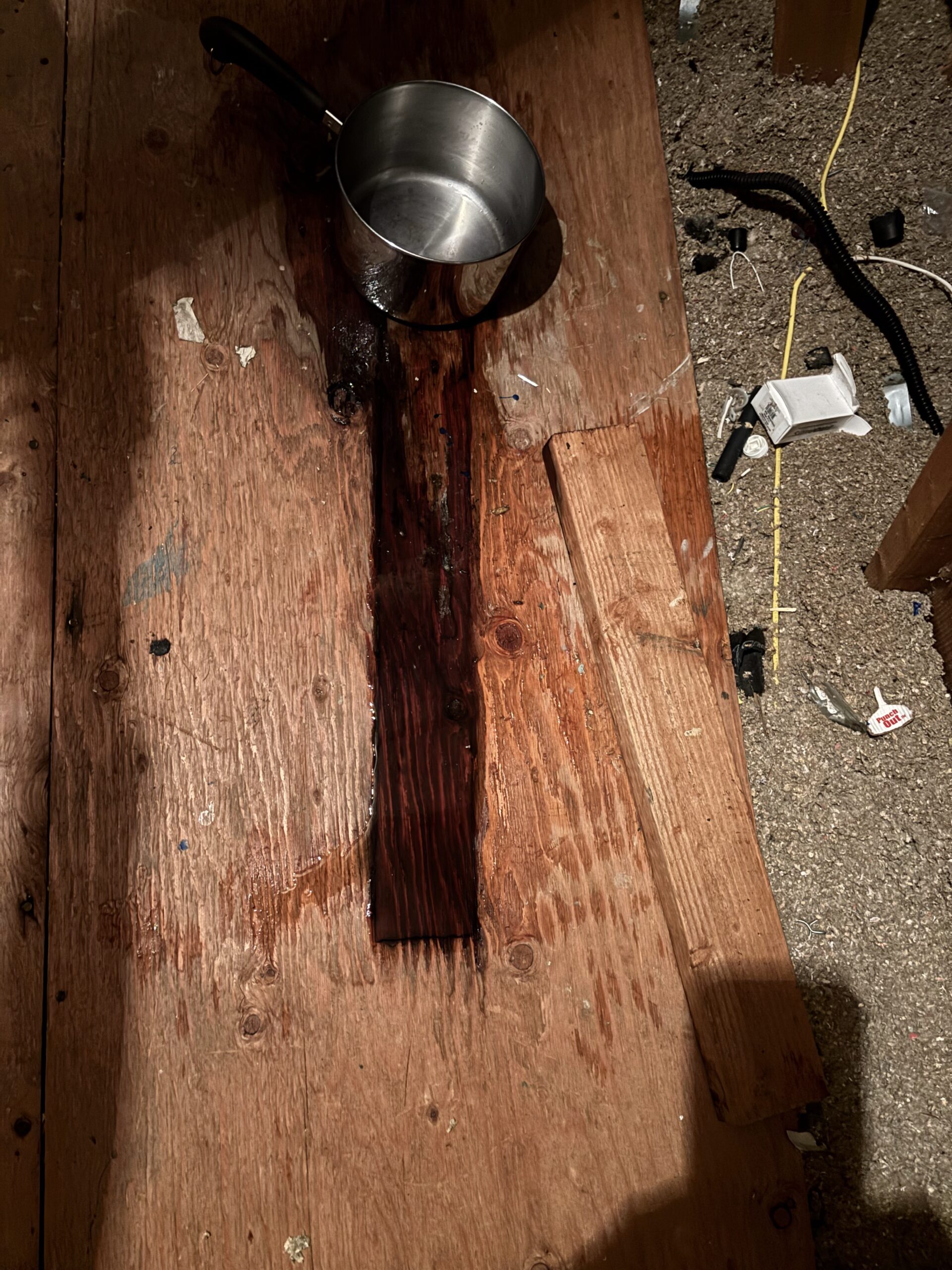 Wet attic platform showing long-term water intrusion from furnace flue leak in Lincoln CA