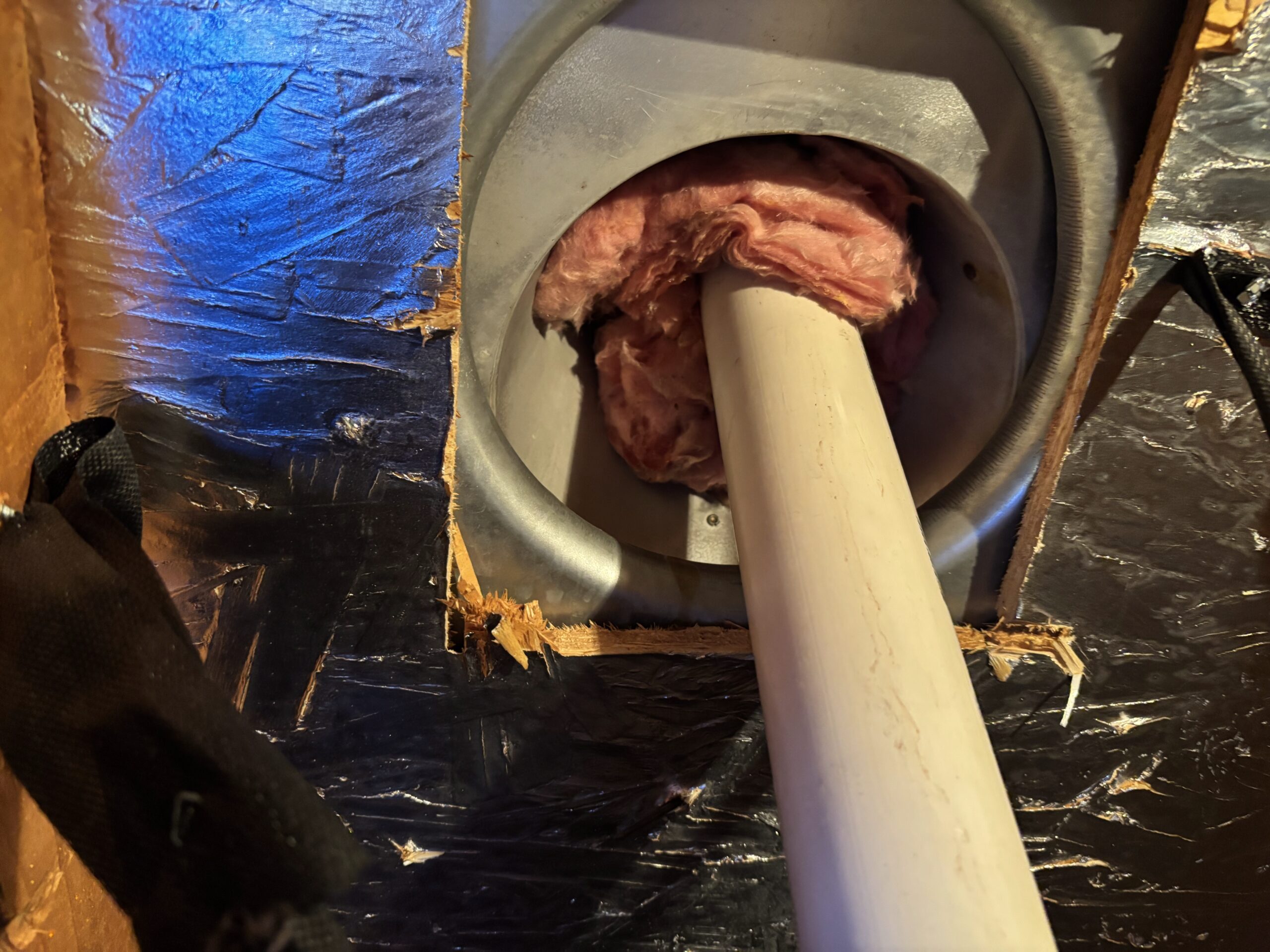 High-efficiency furnace flue pipe connection during repair in Sun City Hills Lincoln