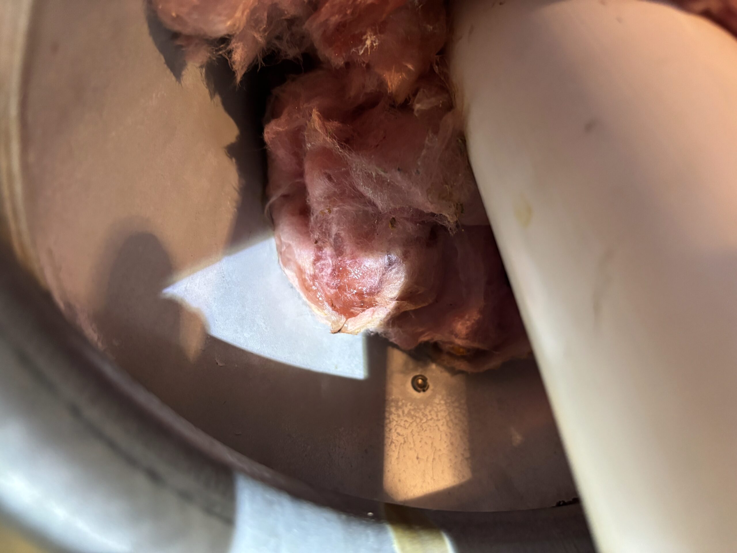 Close-up of moisture damage near furnace flue pipe inside attic in Lincoln CA