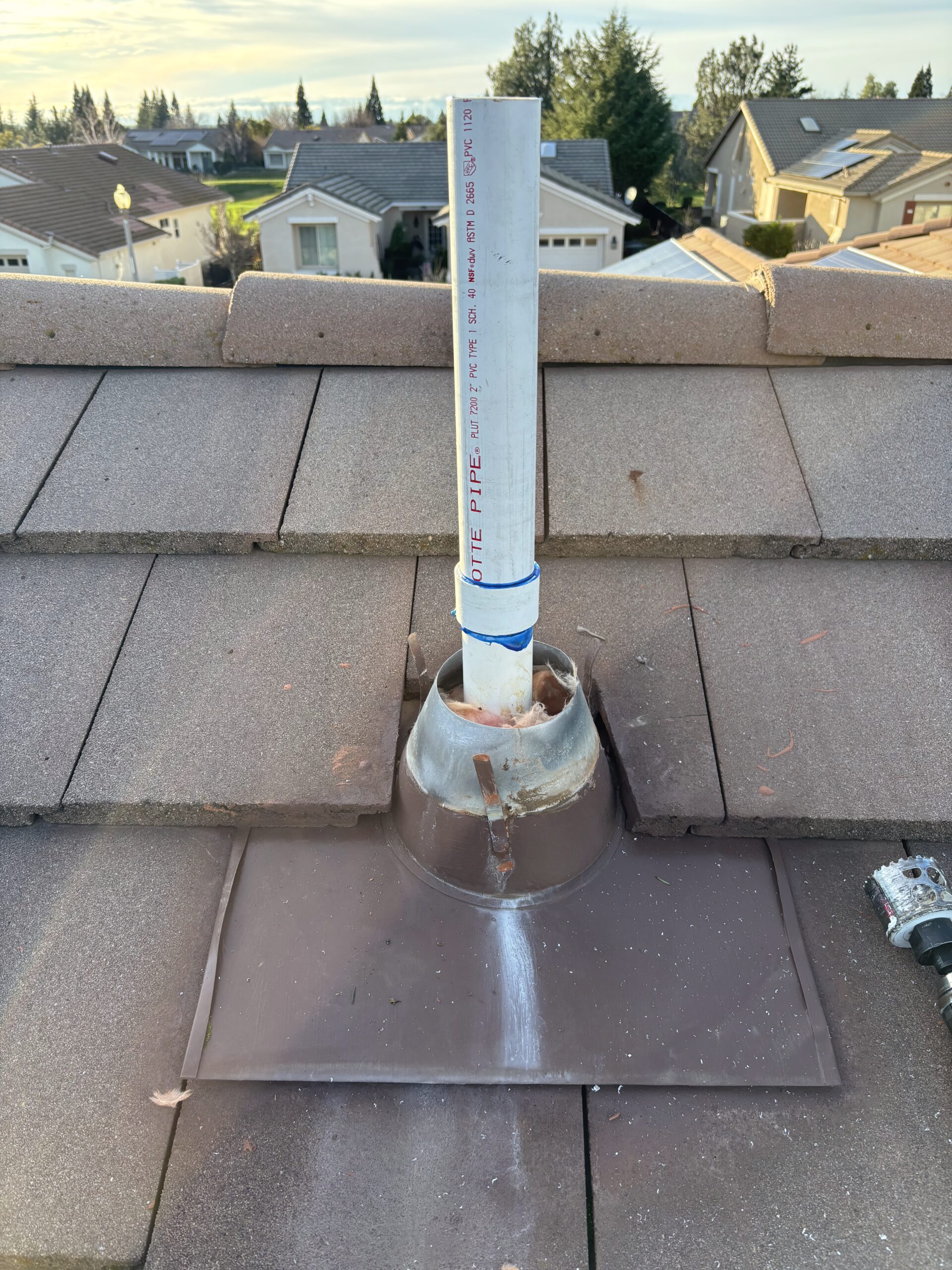 Corrected furnace flue pipe venting through roof after repair in Sun City Hills