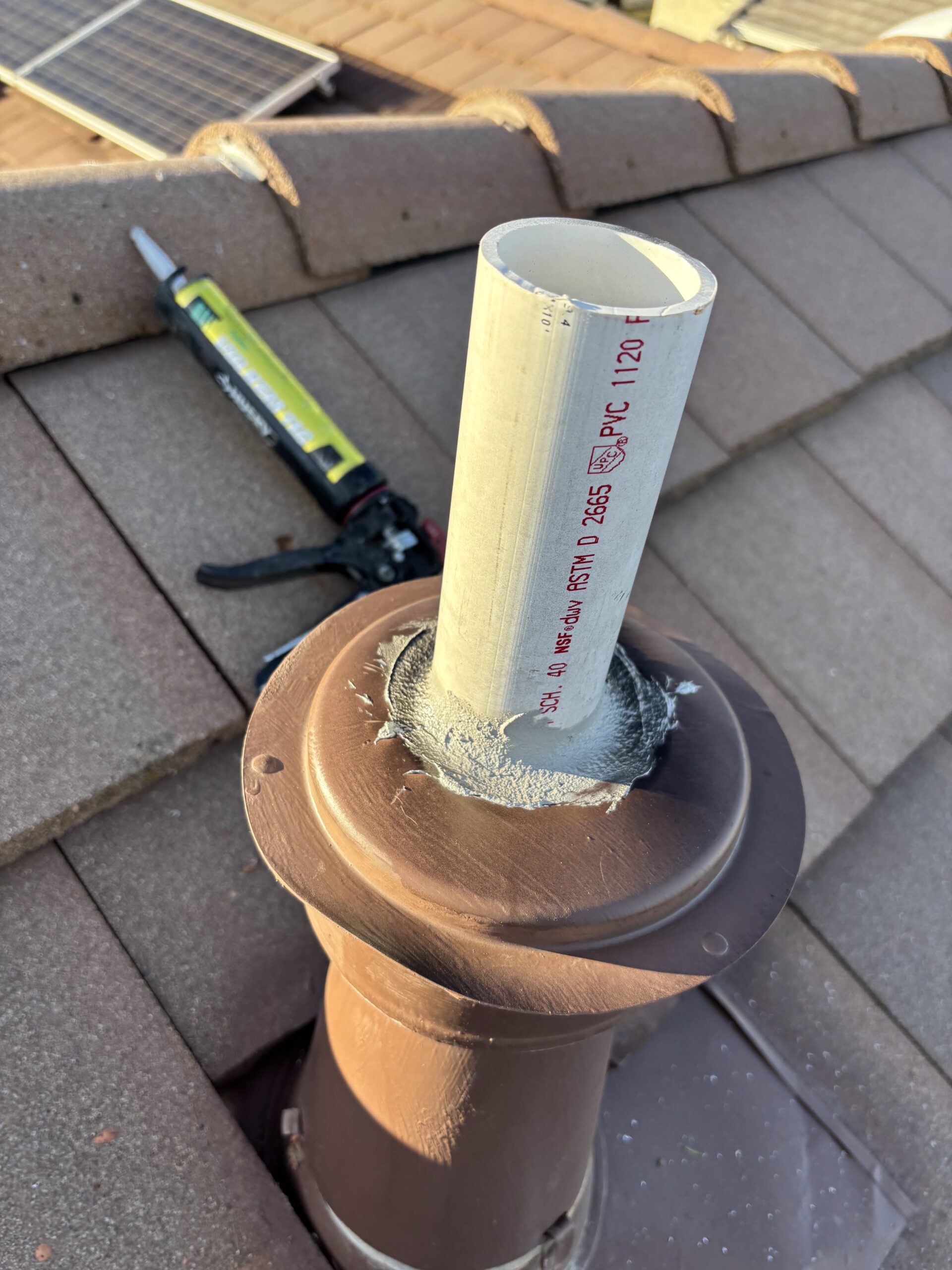Roof-mounted furnace flue pipe properly sealed and vented to code in Lincoln CA